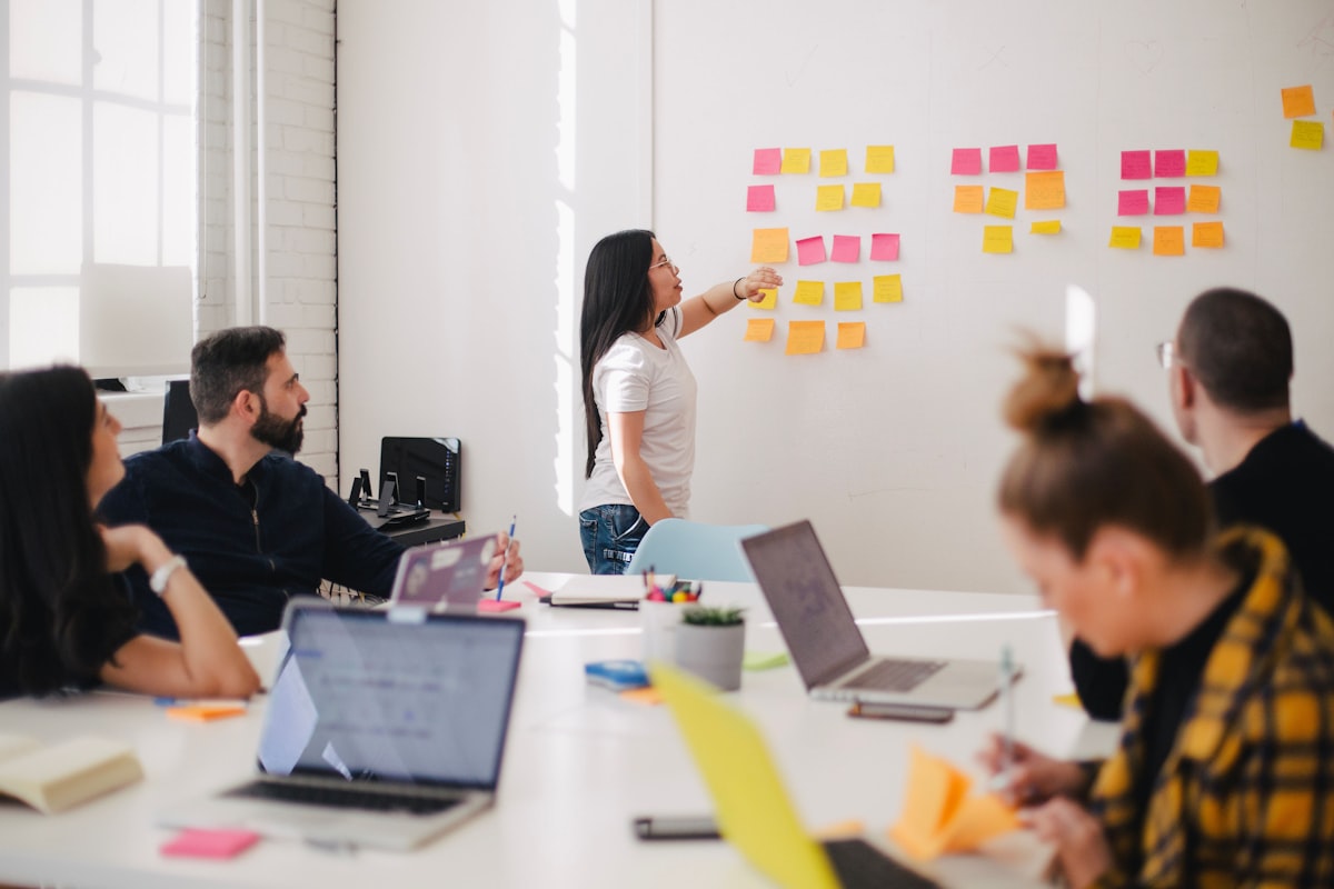 Creator planning short-form content on a desk with notes and a laptop