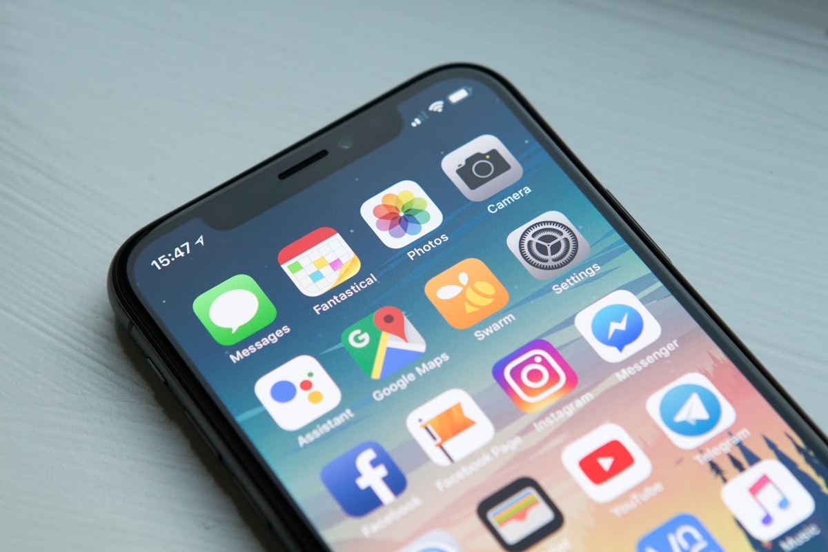 Smartphone showing social media content — where your scripted videos will live